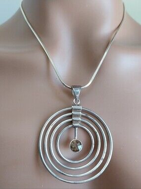 Sterling Silver Multi-Ring Pendant Necklace with Smoky Crystal